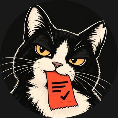 The cat: black and cream, amber eyes, a nicked ear, and a red receipt in its mouth